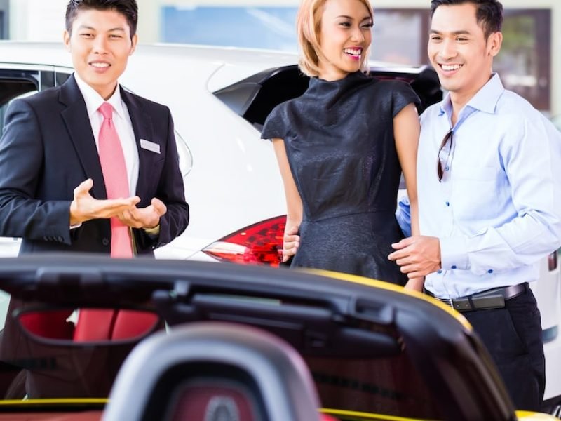 asian-couple-buying-car-auto-dealership-consulting-salesman_79405-13433 (1)